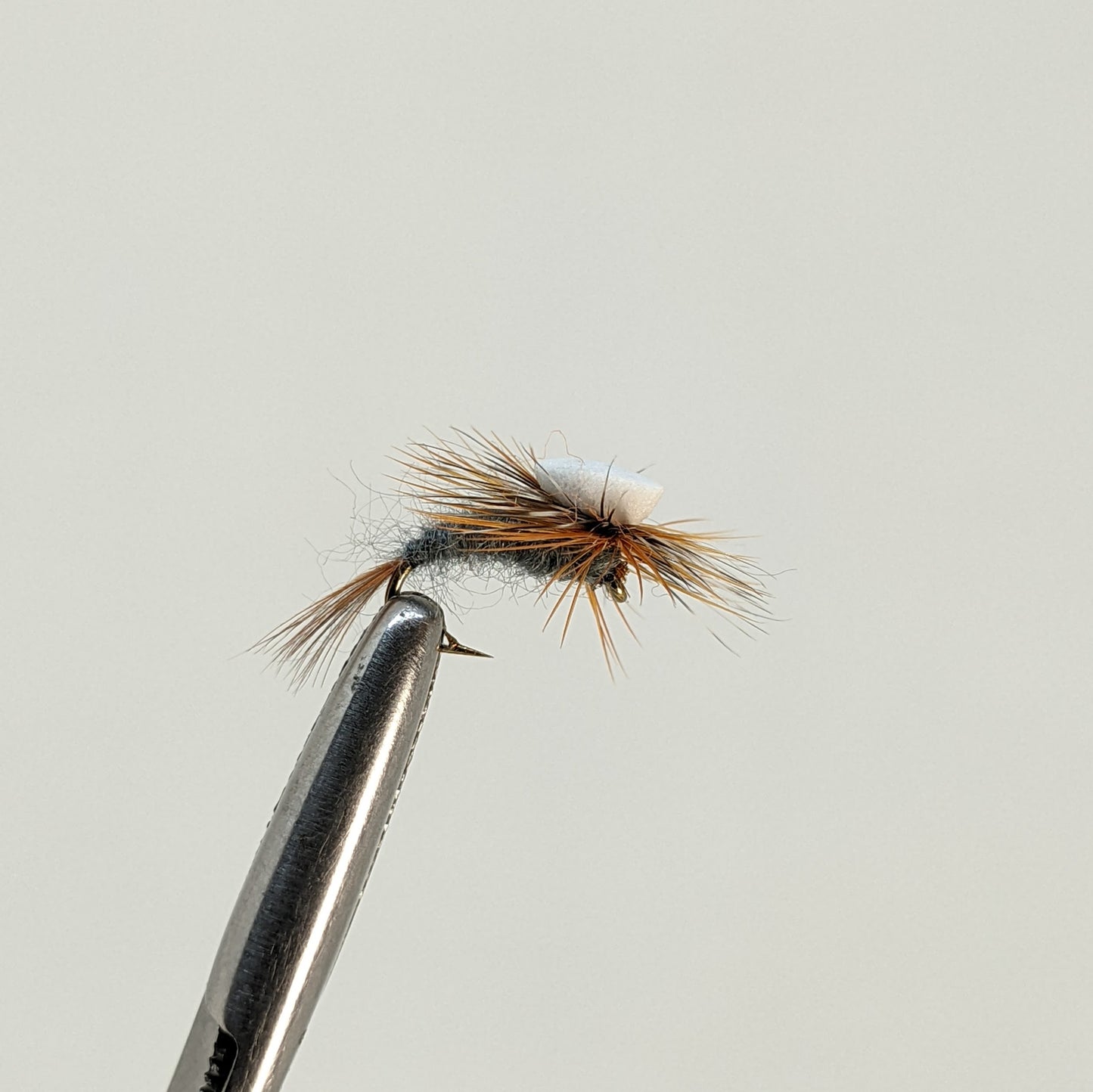 Adams Emerger Fly fishing fly. Dry, subsurface and nymph flies for anglers and fisherman. All the flies you need for sale online. Flies to buy online. Online fly fishing supplies. Catch fish with flies from Frontier Flies.