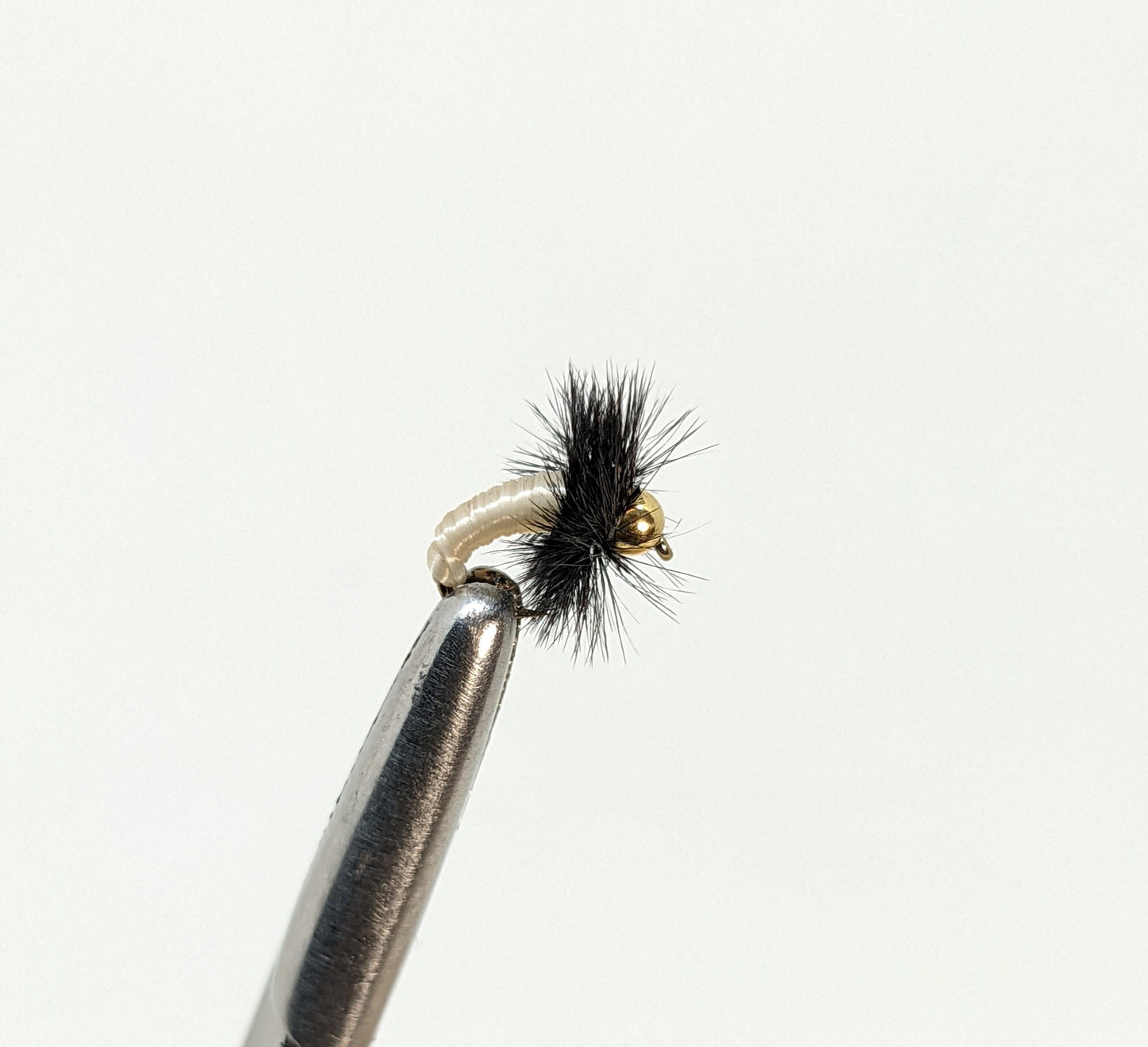 Caddis Larva Bead Head Creme Fly fishing fly. Dry, subsurface and nymph flies for anglers and fisherman. All the flies you need for sale online. Flies to buy online. Online fly fishing supplies. Catch fish with flies from Frontier Flies.