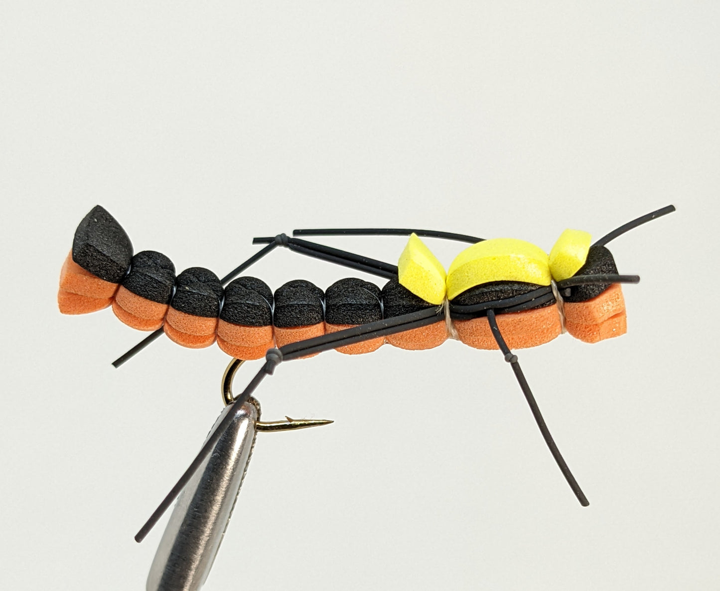 Foam Hopper Orange Fly fishing fly. Dry, subsurface and nymph flies for anglers and fisherman. All the flies you need for sale online. Flies to buy online. Online fly fishing supplies. Catch fish with flies from Frontier Flies.