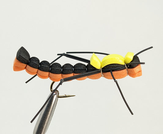 Foam Hopper Orange Fly fishing fly. Dry, subsurface and nymph flies for anglers and fisherman. All the flies you need for sale online. Flies to buy online. Online fly fishing supplies. Catch fish with flies from Frontier Flies.