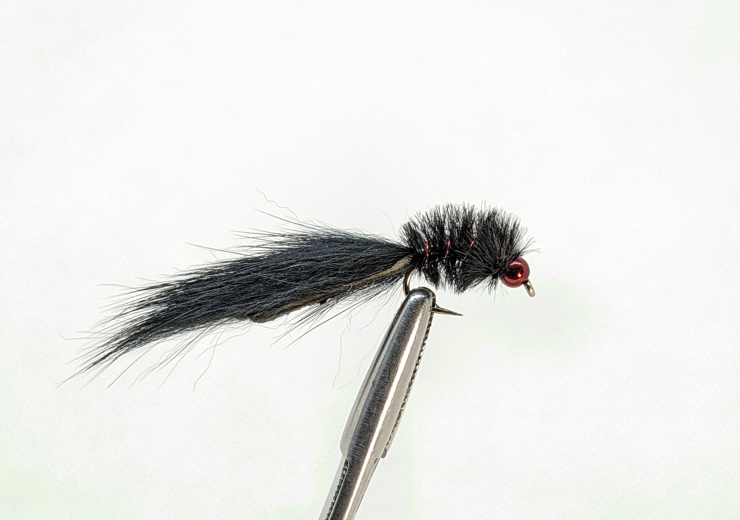 Micro Leech Bead Head Black Fly fishing fly. Dry, subsurface and nymph flies for anglers and fisherman. All the flies you need for sale online. Flies to buy online. Online fly fishing supplies. Catch fish with flies from Frontier Flies.