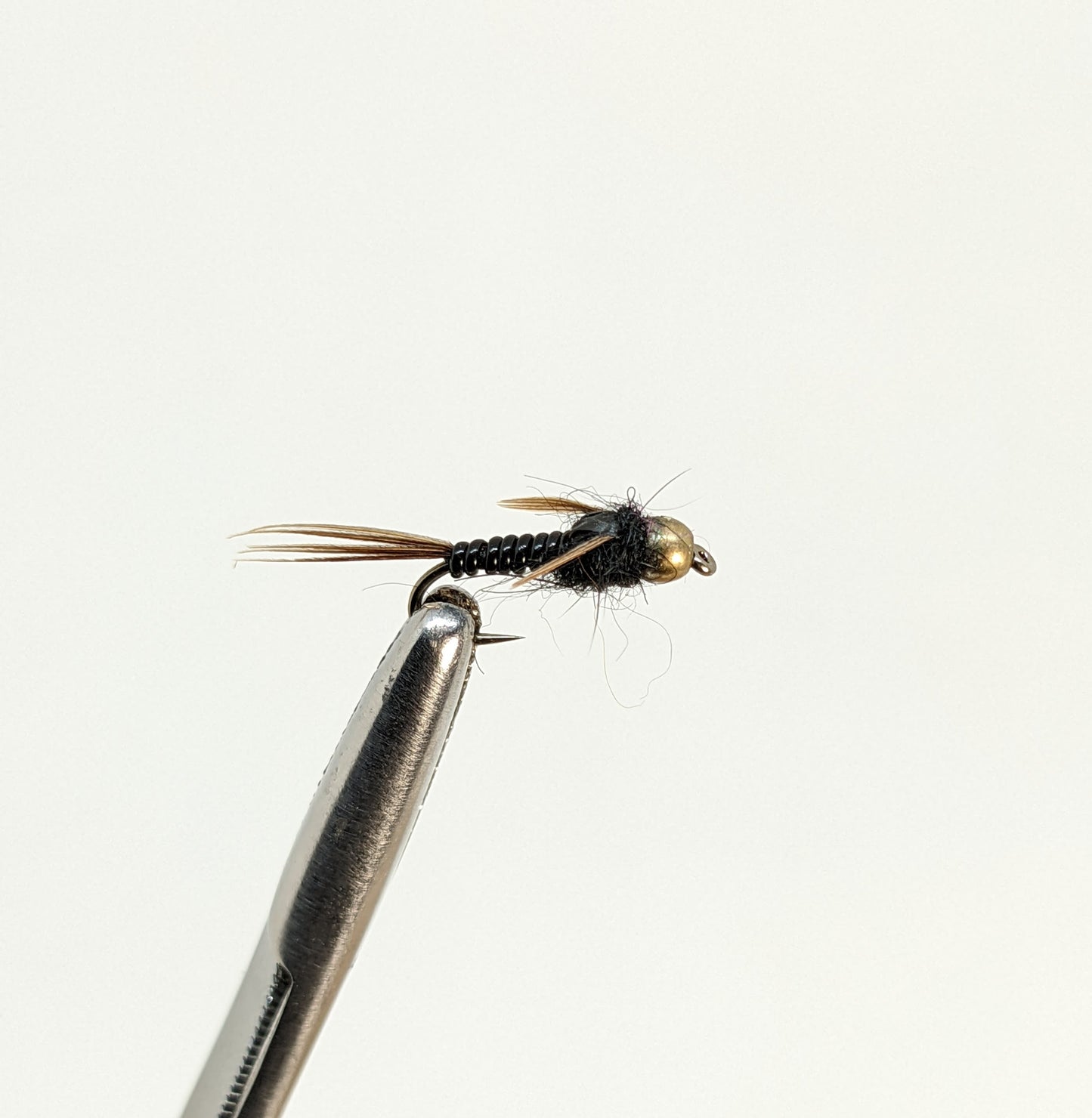Nymphomaniac Bead Head Black Fly fishing fly. Dry, subsurface and nymph flies for anglers and fisherman. All the flies you need for sale online. Flies to buy online. Online fly fishing supplies. Catch fish with flies from Frontier Flies.